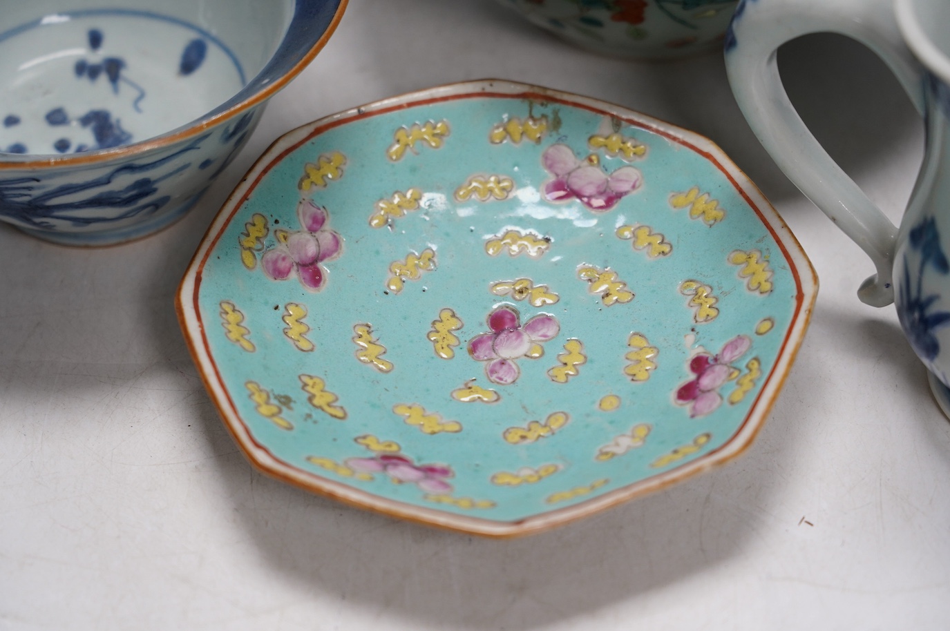 A Chinese blue and white Ming dynasty bowl, a blue and white mug and two pieces of famille rose (4), tallest 12cm. Condition - good